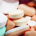 There is a pile of various medicines in tablets on the table.